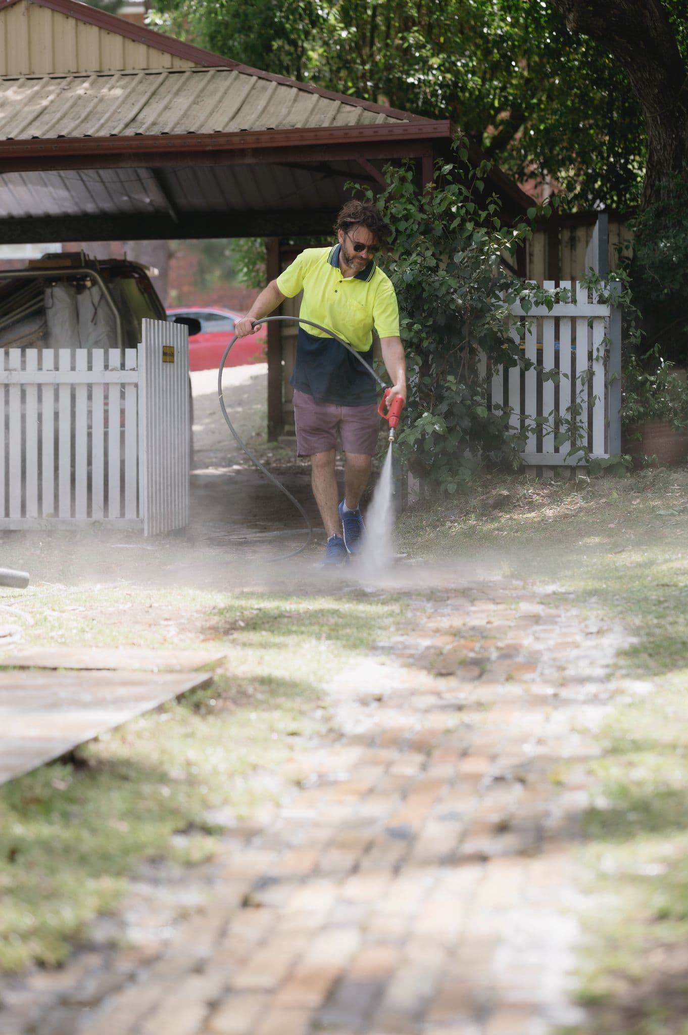 Washlord soft-washing a home exterior