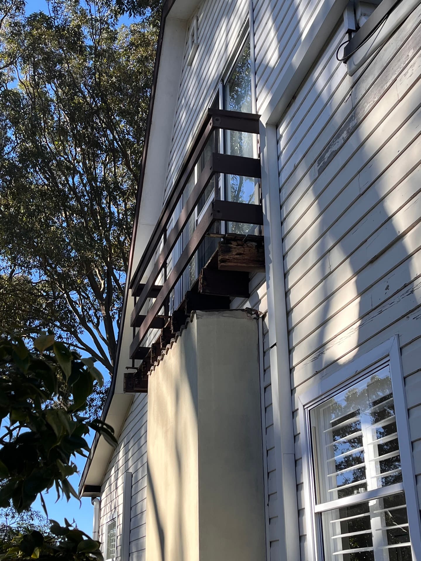 Ladder access for gutter cleaning on a weatherboard home