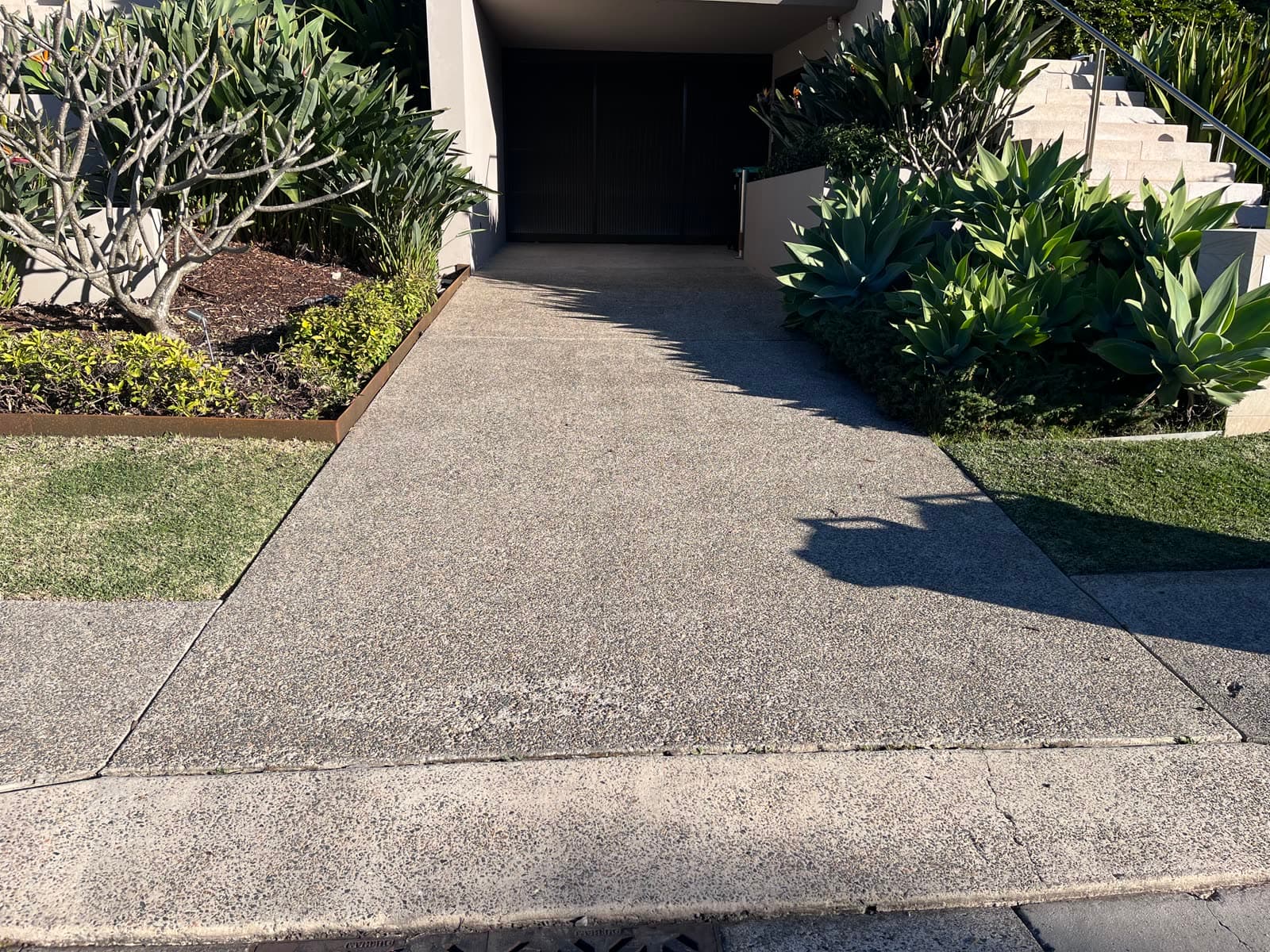 Exposed aggregate driveway after Washlord pressure clean — Northern Beaches