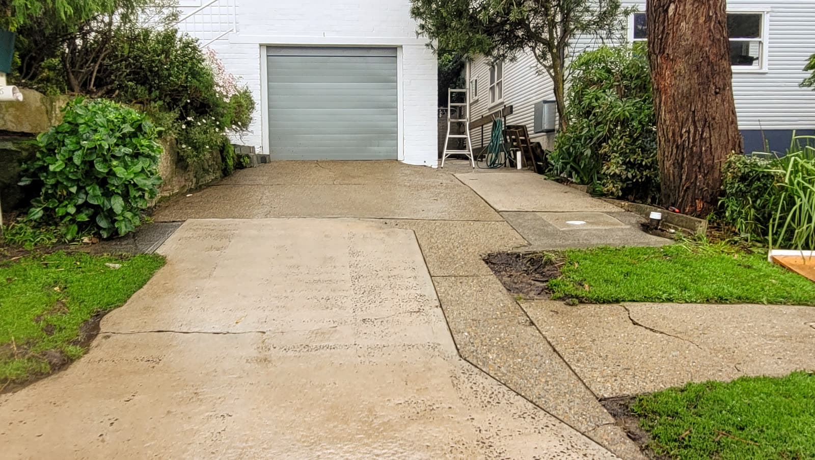 Clean concrete driveway after Washlord pressure clean — Northern Beaches