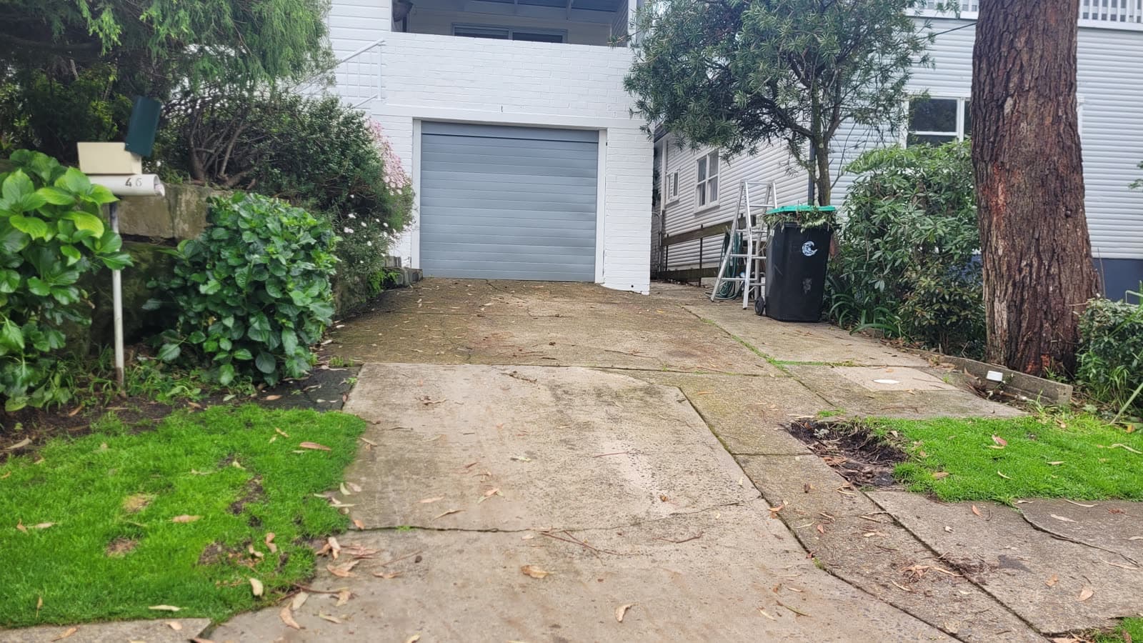 Grimy concrete driveway before pressure cleaning — Northern Beaches