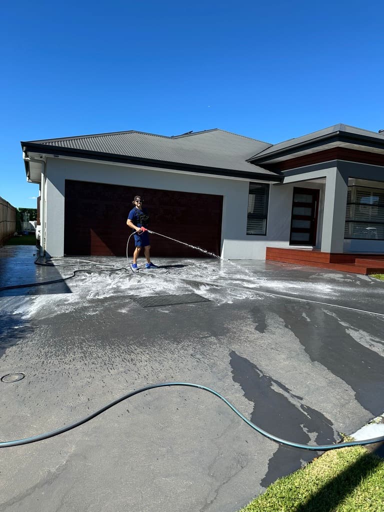 Soft-washing a residential driveway
